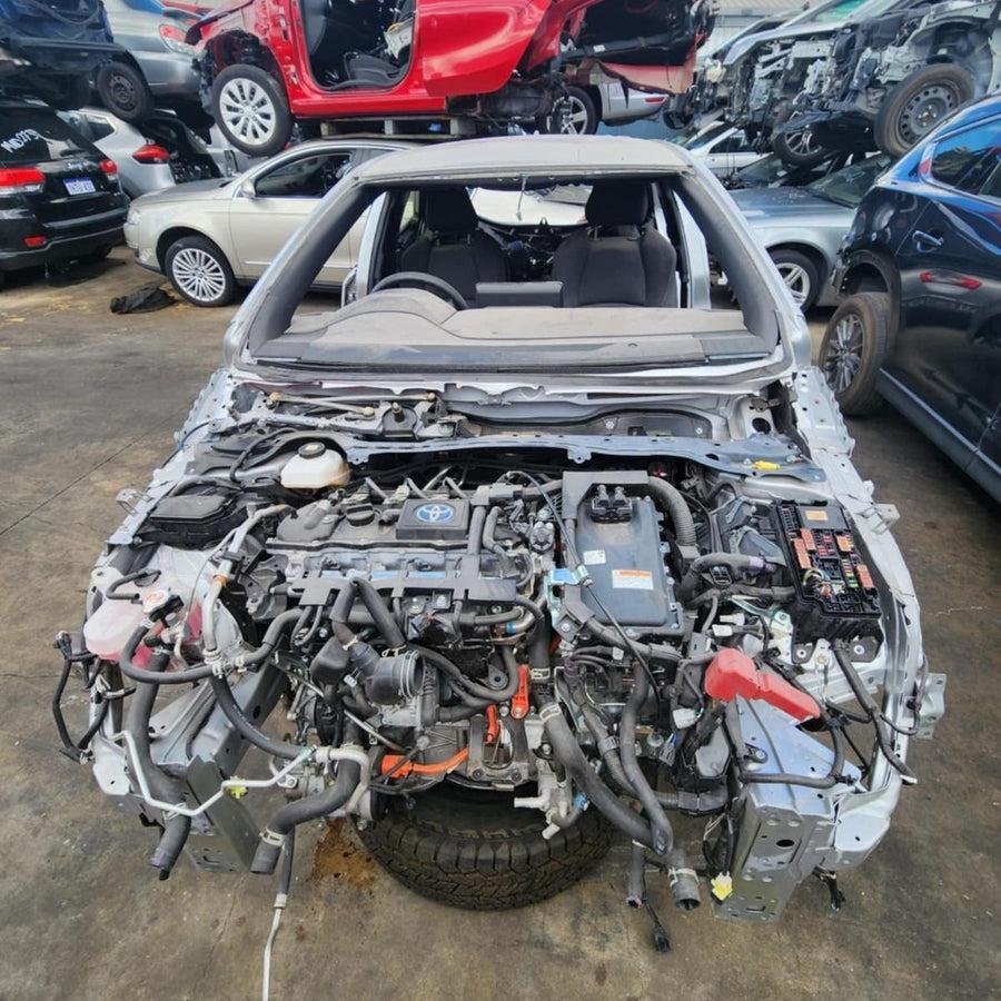 Toyota hybrid front cut with petrol engine, hybrid transaxle, inverter and orange high voltage cabling